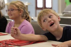 kids learning bandana trick at Texas magic academy